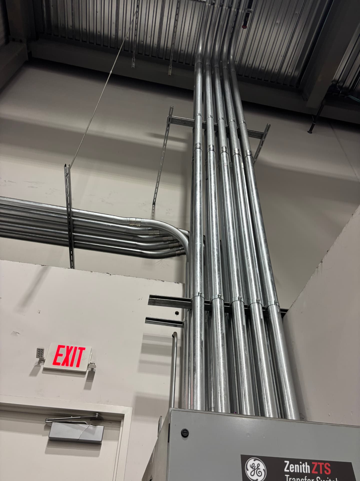 Overhead conduit run to a GE Zenith transfer switch