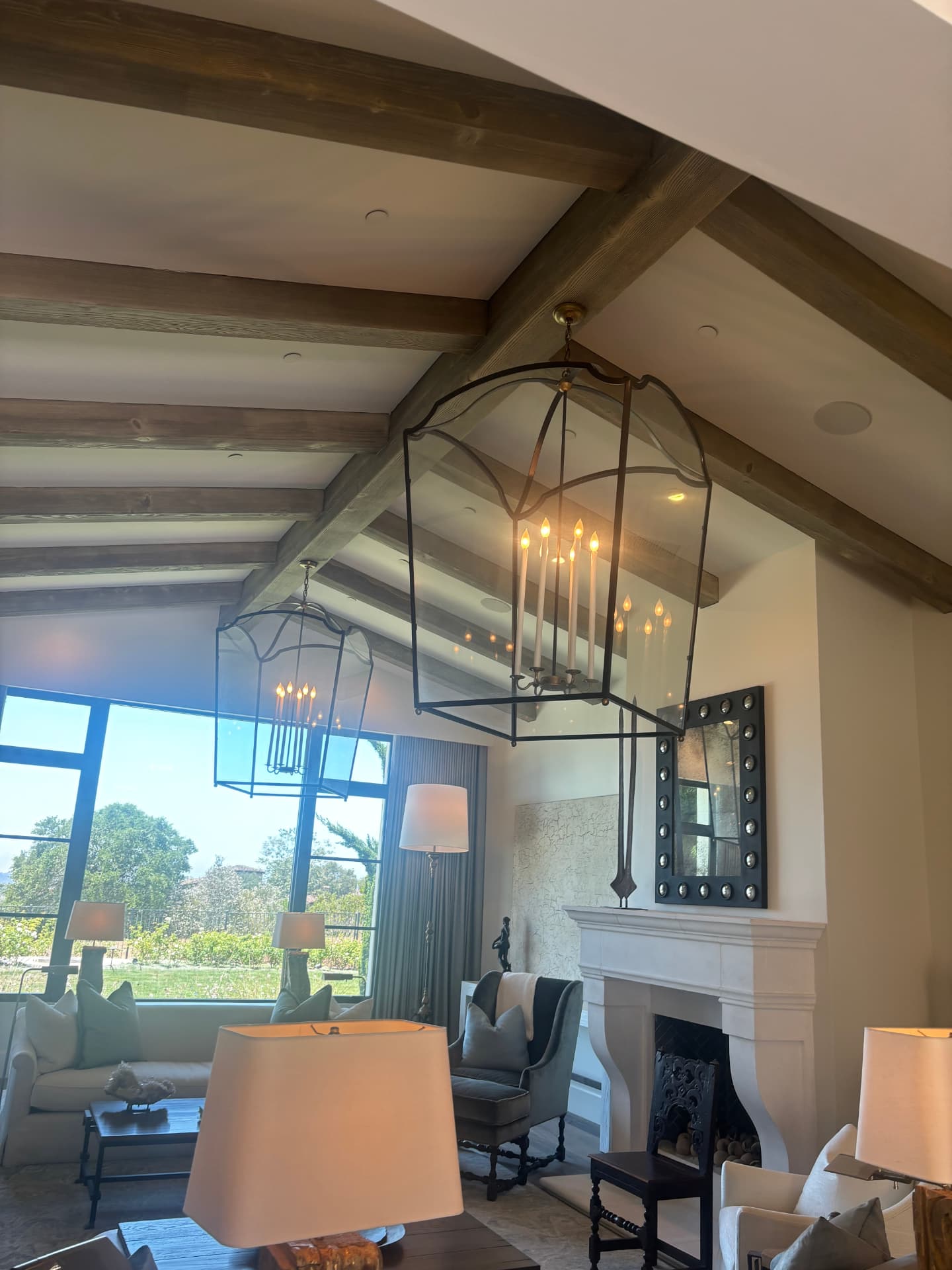 Lantern chandeliers on a wood beam ceiling